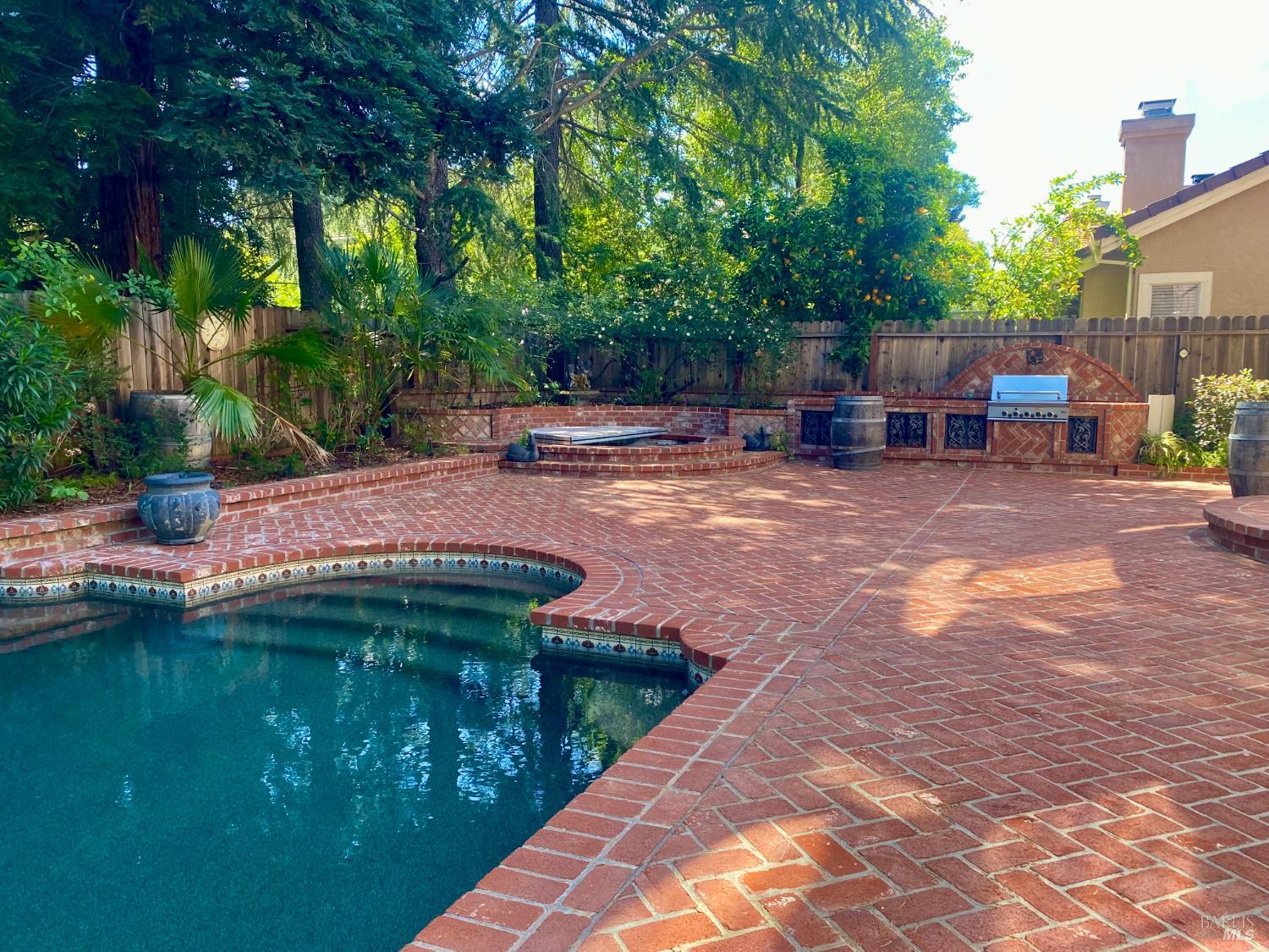 3229 Seminole Circle Fairfield, CA 94534 - Photo 45 of 73 a backyard of a house with barbeque oven fire pit table and chairs