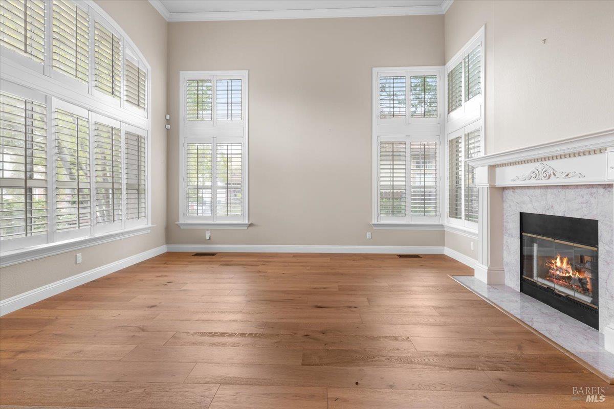 3229 Seminole Circle Fairfield, CA 94534 - Photo 9 of 73 a view of an empty room with wooden floor and a window