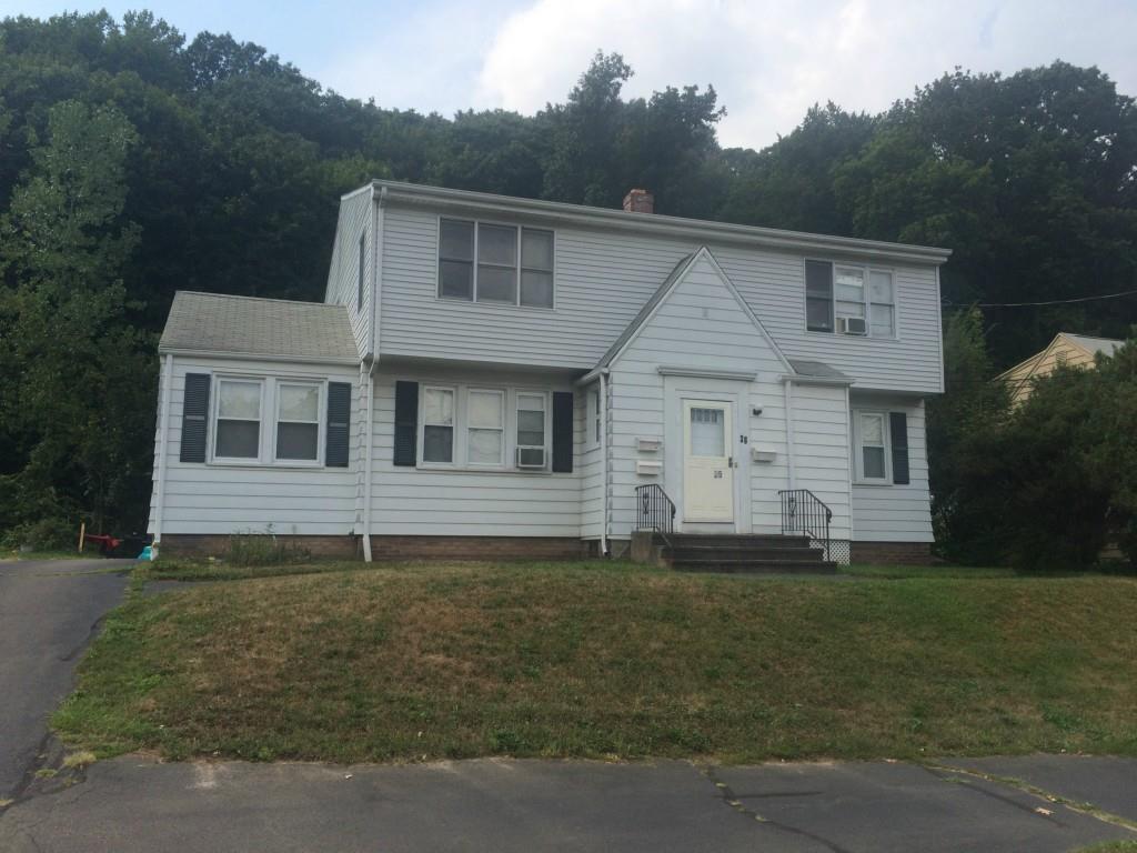36 Huntington Road New Haven, CT 06512 - Photo 1 of 1 a front view of a house with a garden