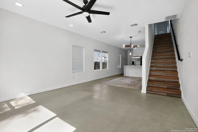 a view of a livingroom with a staircase