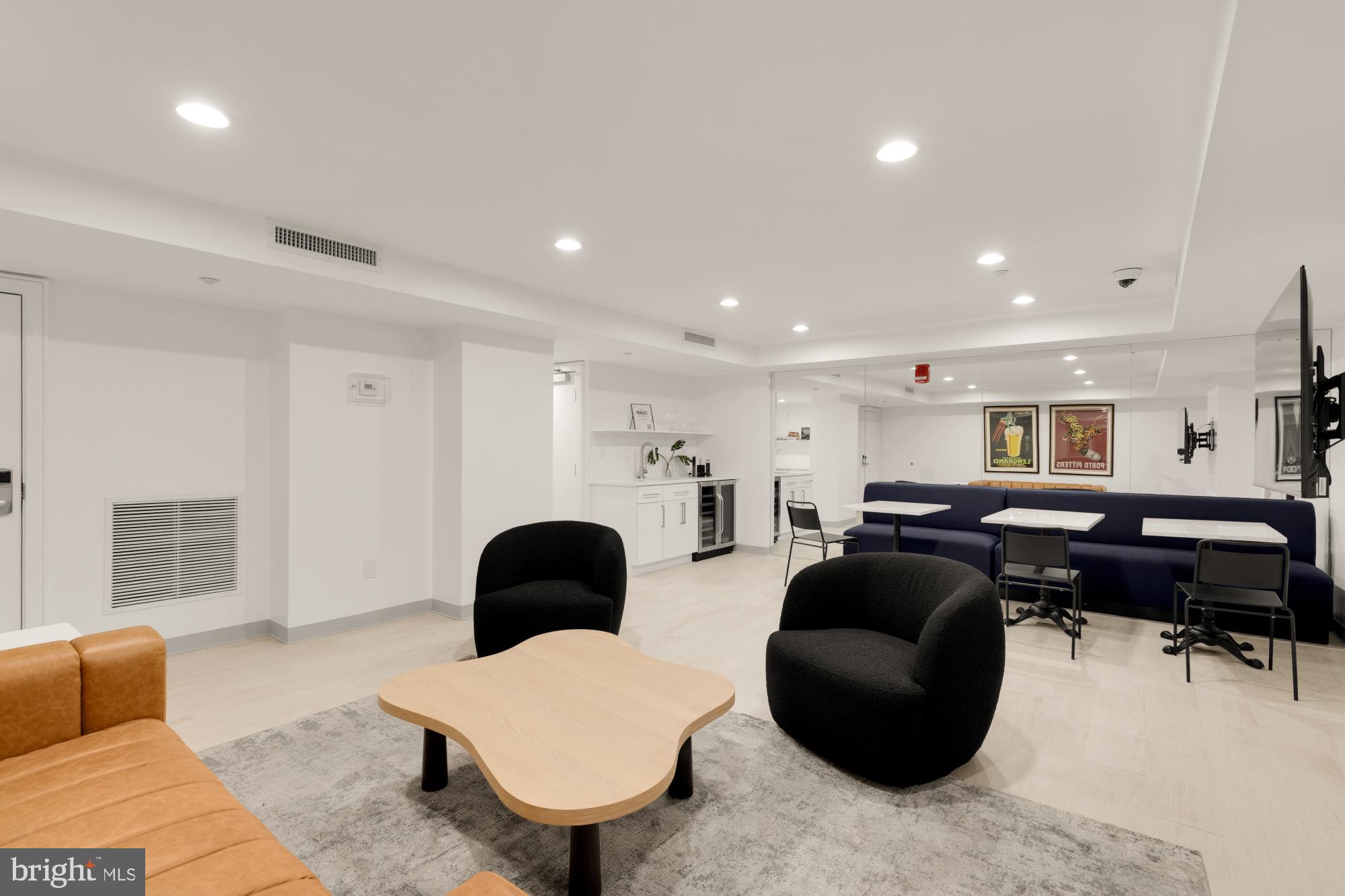 1150 K Street Northwest, Unit 1211 Washington, DC 20005 - Photo 23 of 29 a living room with furniture ceiling fan and a window