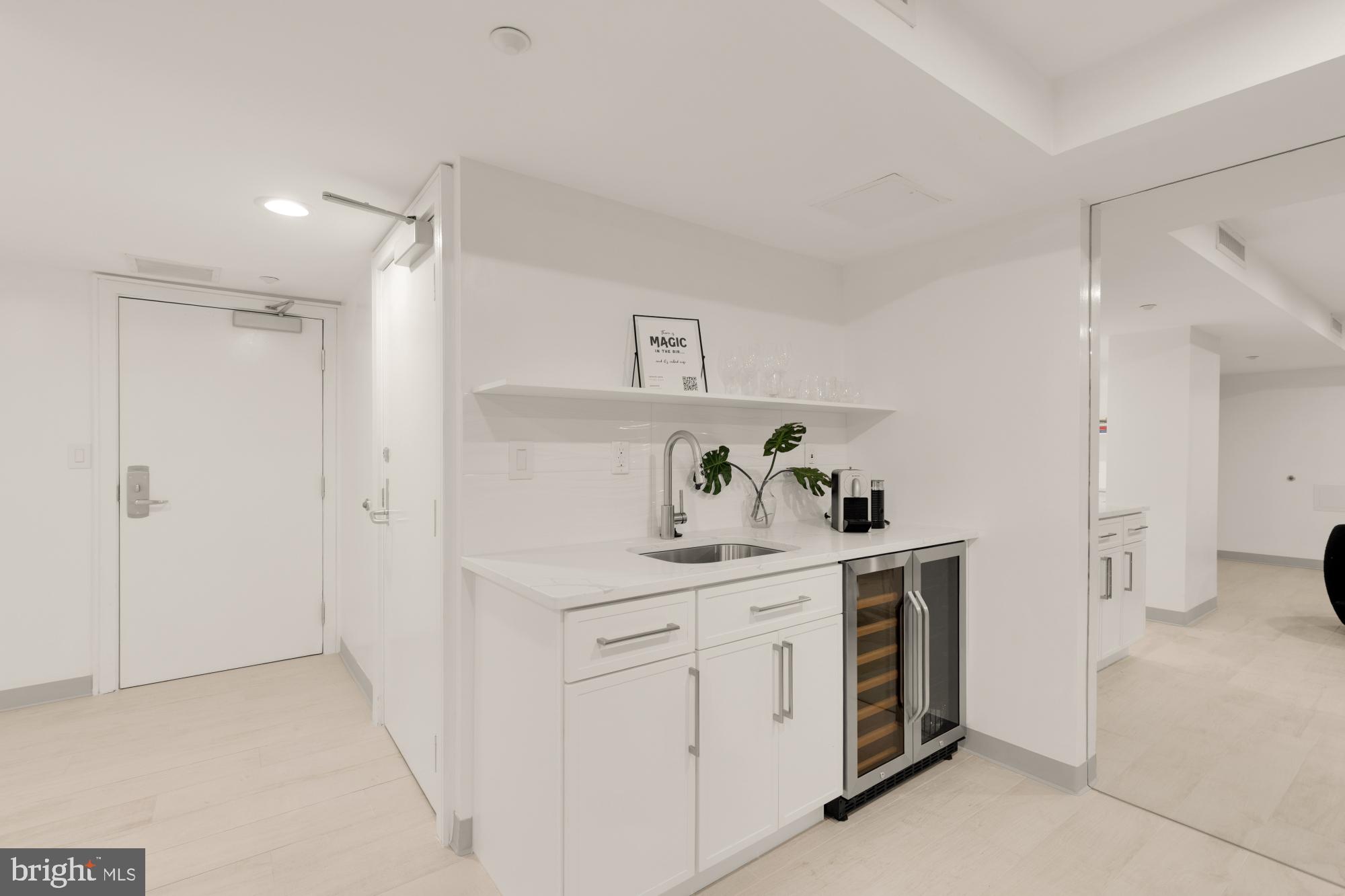 1150 K Street Northwest, Unit 1211 Washington, DC 20005 - Photo 25 of 29 a kitchen with a sink and cabinets
