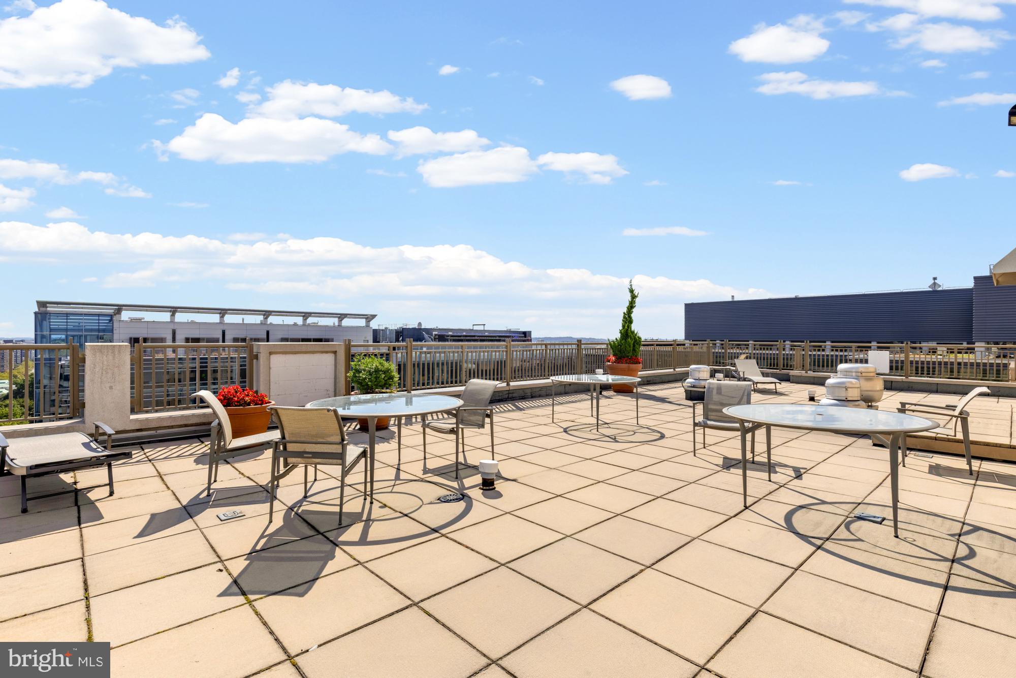 1150 K Street Northwest, Unit 1211 Washington, DC 20005 - Photo 26 of 29 a view of a terrace with furniture and outdoor kitchen
