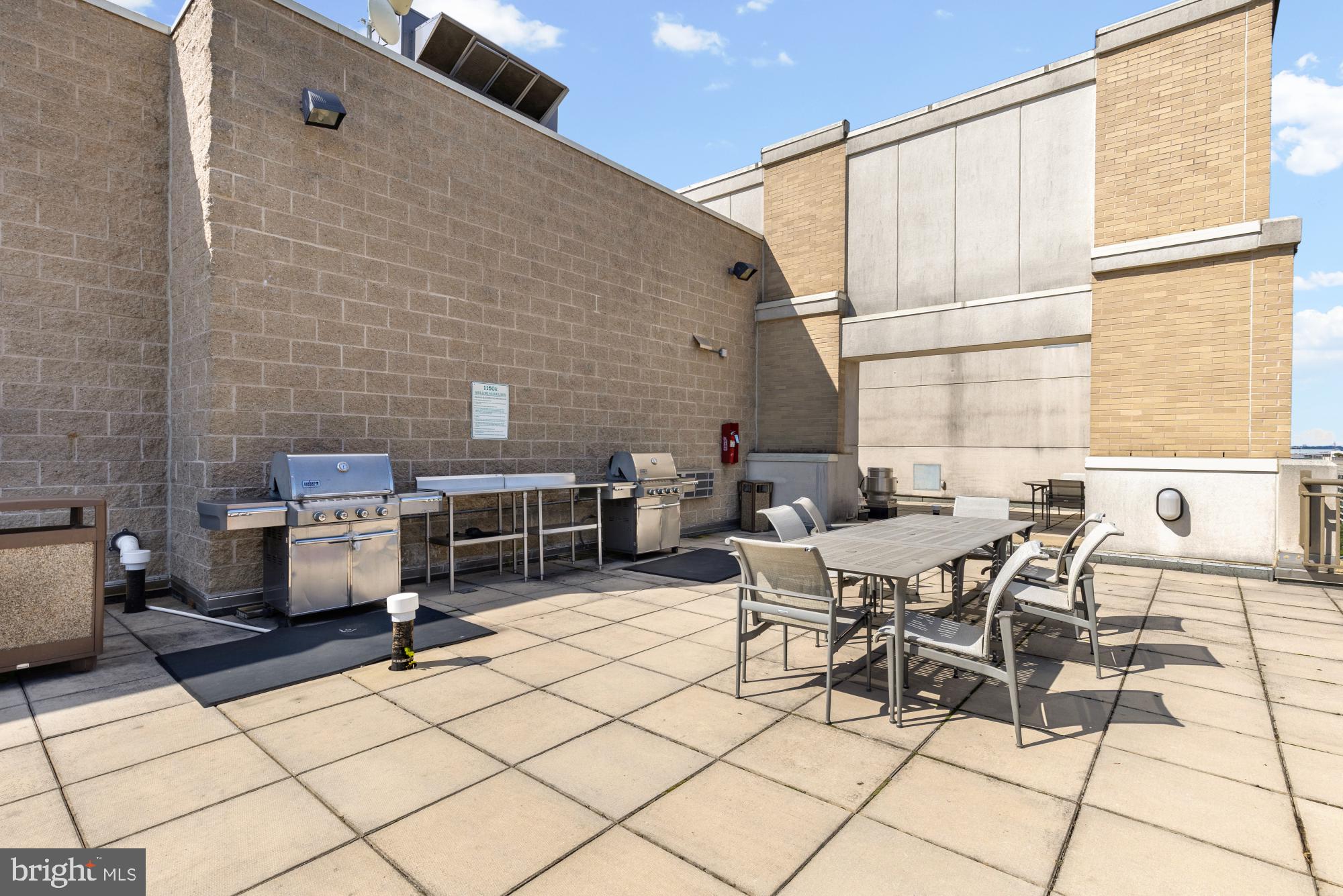1150 K Street Northwest, Unit 1211 Washington, DC 20005 - Photo 28 of 29 a patio with table and chairs
