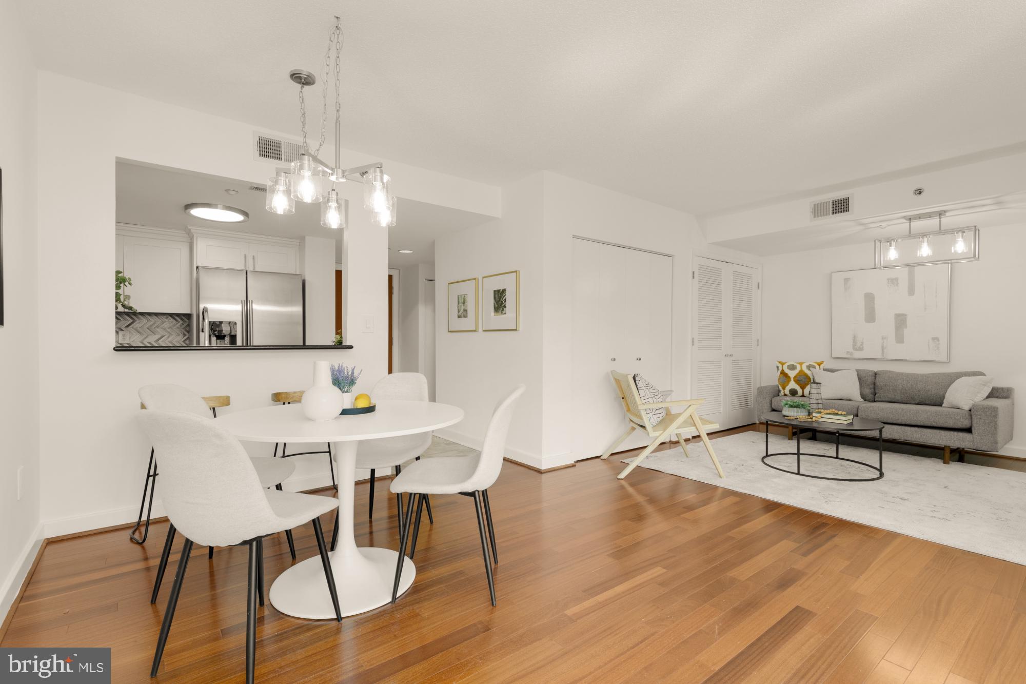 1150 K Street Northwest, Unit 1211 Washington, DC 20005 - Photo 7 of 29 a view of a dining room with furniture and wooden floor