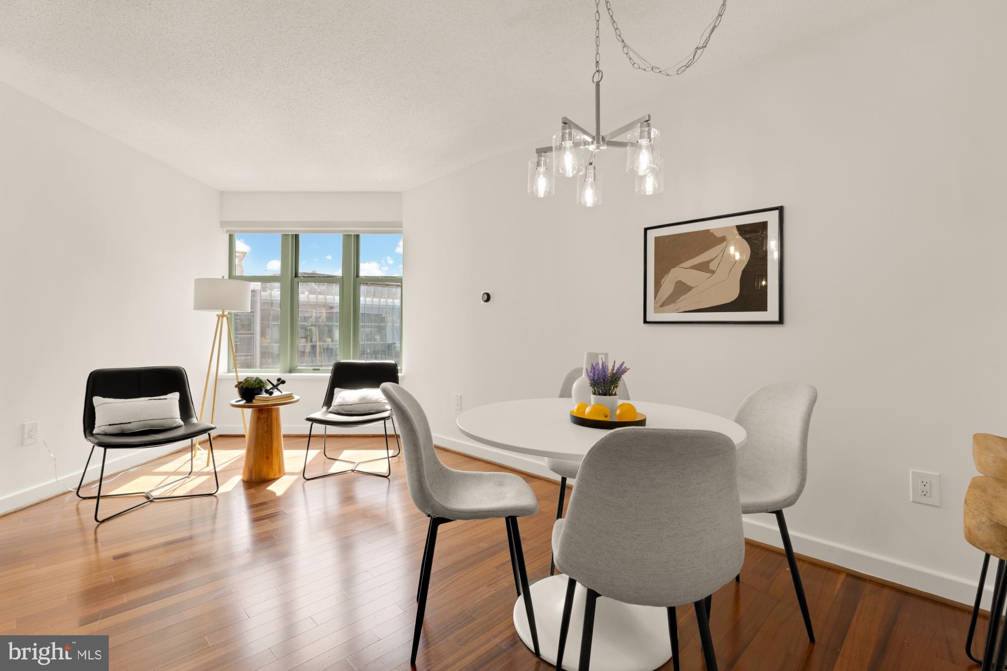 1150 K Street Northwest, Unit 1211 Washington, DC 20005 - Photo 8 of 29 a view of a dining room with furniture wooden floor and chandelier
