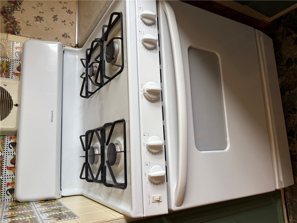 5434 North Waynesville Road, Unit 15 Oregonia, OH 45054 - Photo 12 of 19 This functional kitchen features a range for culinary convenience.