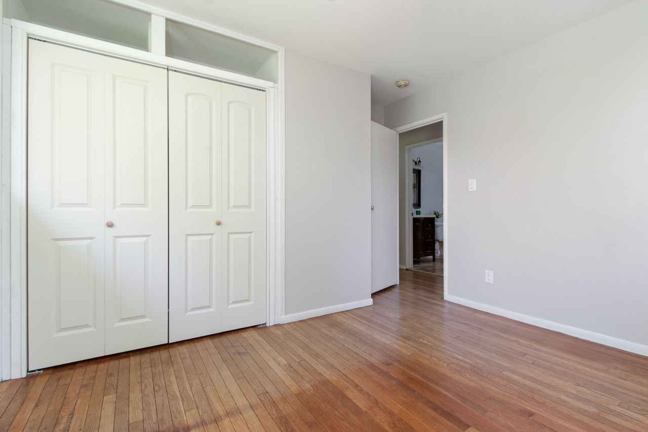 813 Parmon Road Bloomington, IL 61701 - Photo 13 of 23 a view of an empty room with wooden floor