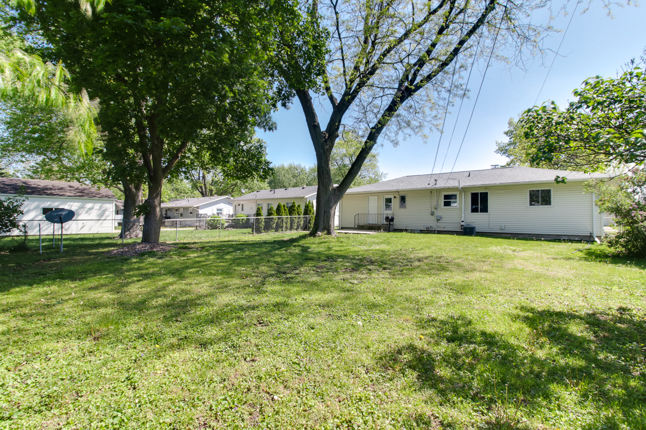 813 Parmon Road Bloomington, IL 61701 - Photo 21 of 23 a front view of house with yard and green space