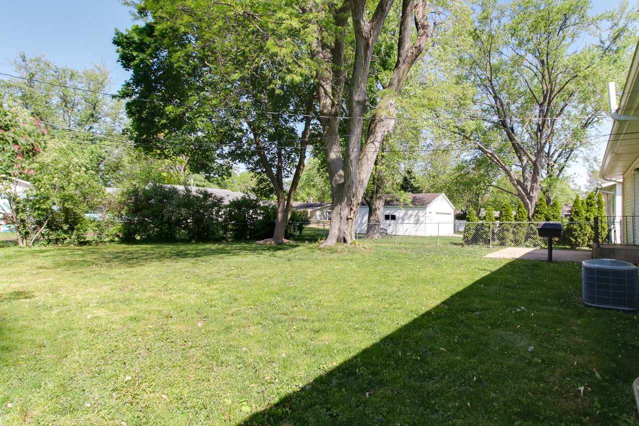 813 Parmon Road Bloomington, IL 61701 - Photo 22 of 23 a view of a trees with basketball court