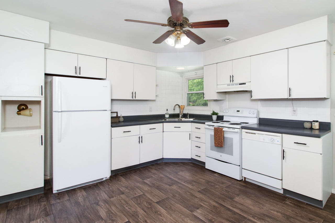 813 Parmon Road Bloomington, IL 61701 - Photo 6 of 23 a kitchen with cabinets stainless steel appliances a sink and a refrigerator