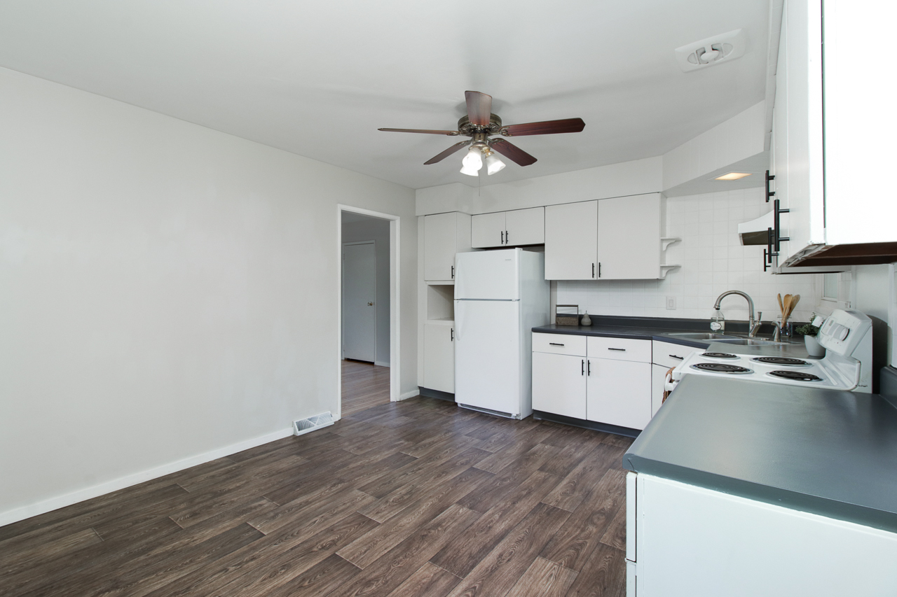 813 Parmon Road Bloomington, IL 61701 - Photo 7 of 23 a kitchen with a refrigerator a sink and dishwasher