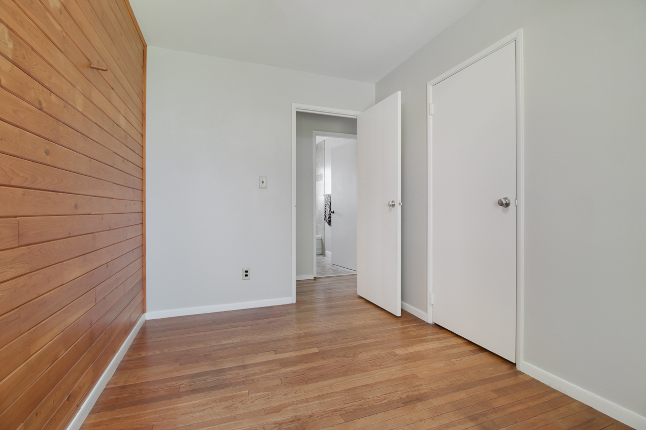 813 Parmon Road Bloomington, IL 61701 - Photo 10 of 23 a view of an empty room with wooden floor