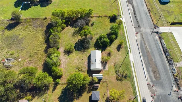 an aerial view of residential houses with swimming pool
