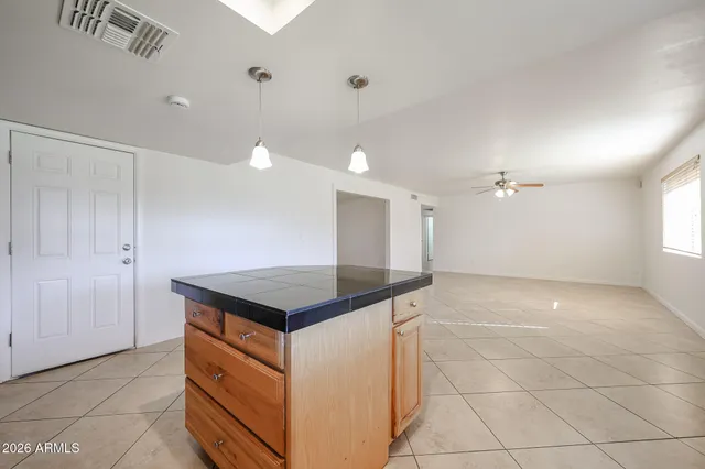 a kitchen with a stove and a refrigerator