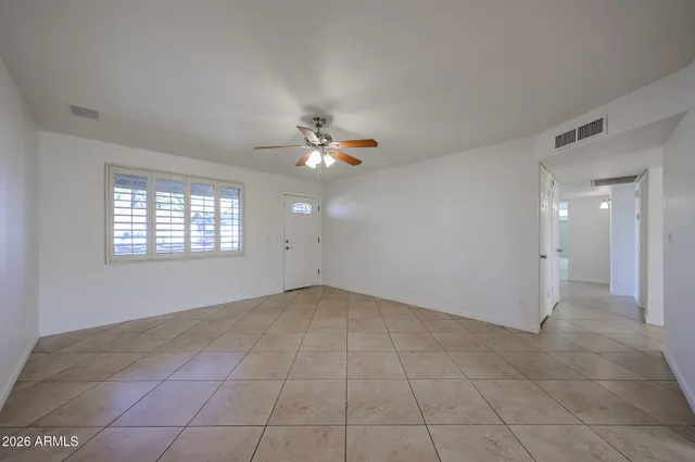 a view of an empty room with a window