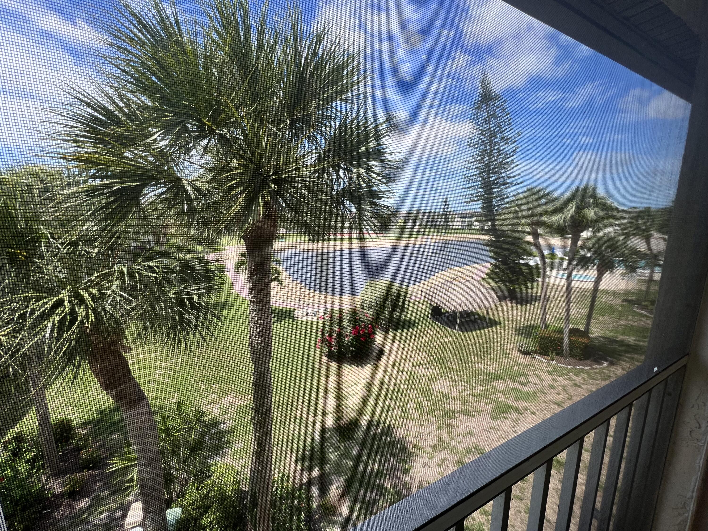 a view of swimming pool from a balcony