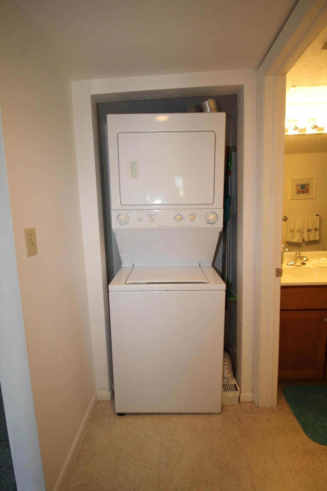 1024 Manatee Naples, Unit C301 Naples, FL 34114 - Photo 13 of 23 a utility room with dryer and washer