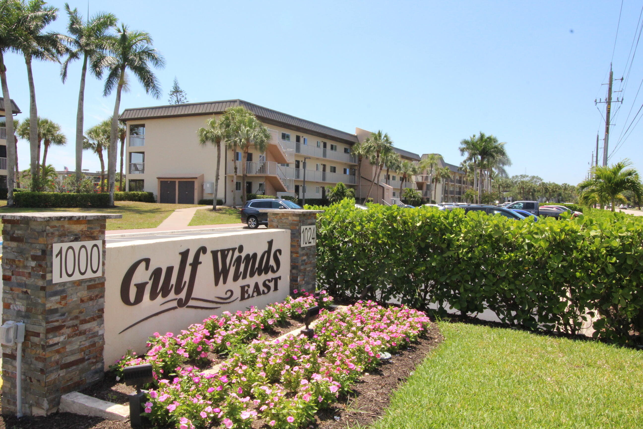 1024 Manatee Naples, Unit C301 Naples, FL 34114 - Photo 14 of 23 a front view of a house with garden