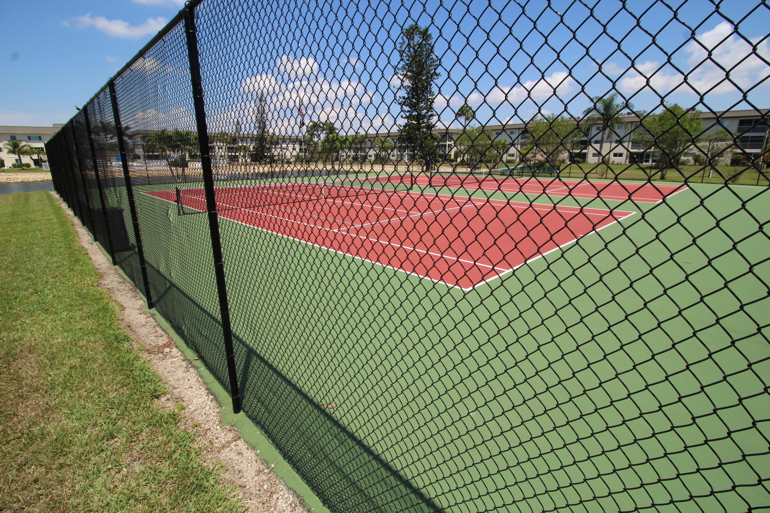 1024 Manatee Naples, Unit C301 Naples, FL 34114 - Photo 20 of 23 a view of a tennis court