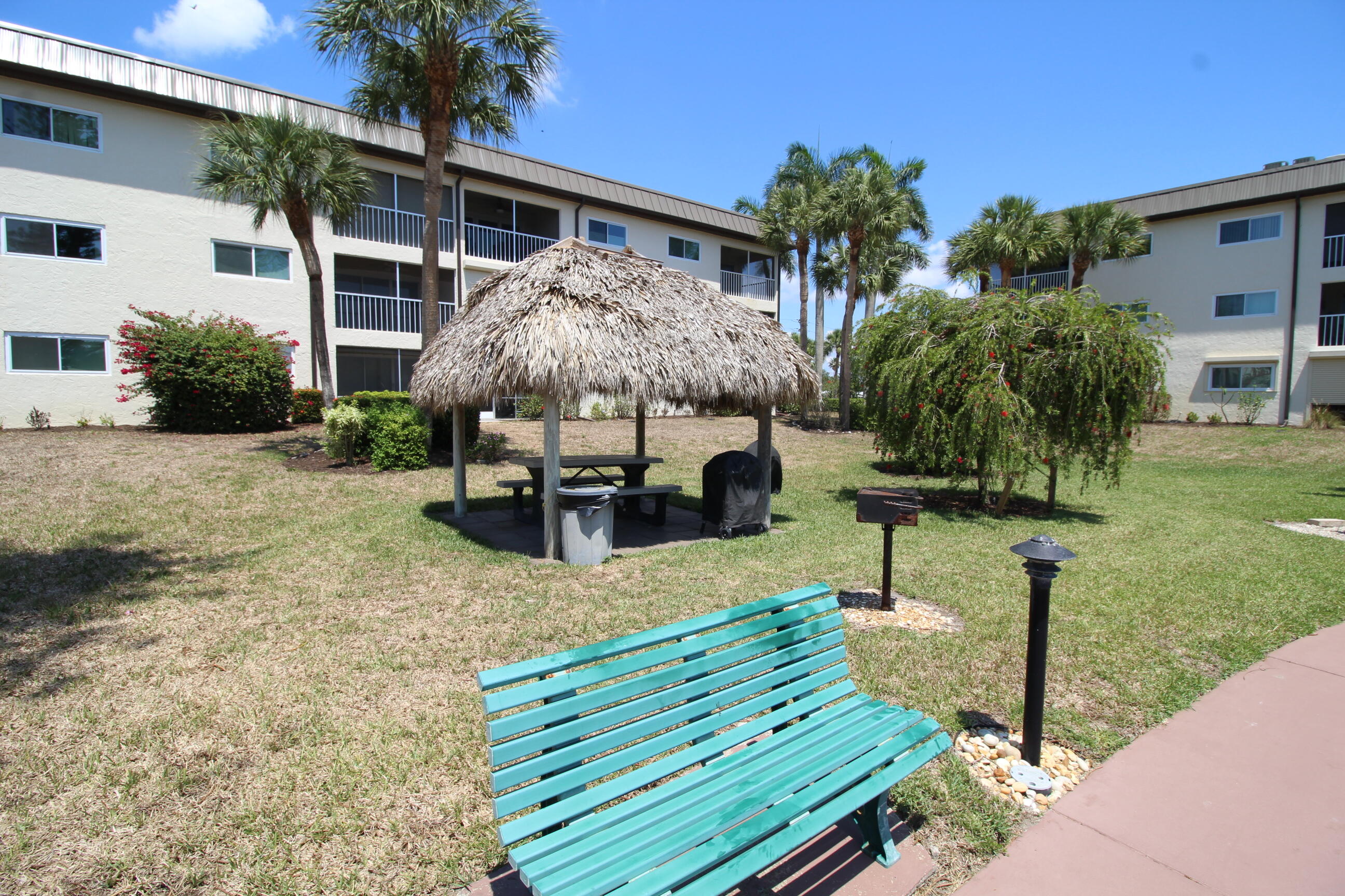 1024 Manatee Naples, Unit C301 Naples, FL 34114 - Photo 21 of 23 a view of a house with backyard and sitting area