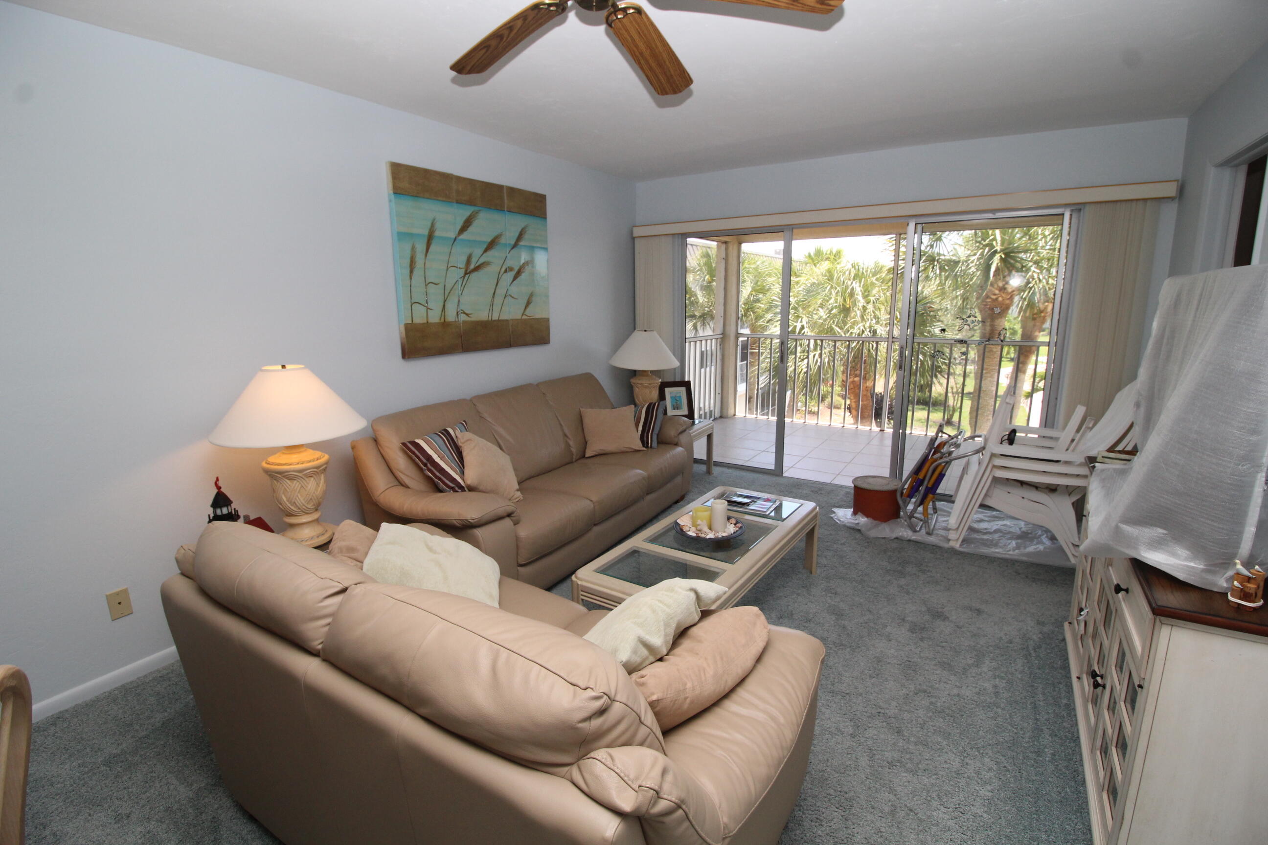 1024 Manatee Naples, Unit C301 Naples, FL 34114 - Photo 3 of 23 a living room with furniture and a large window