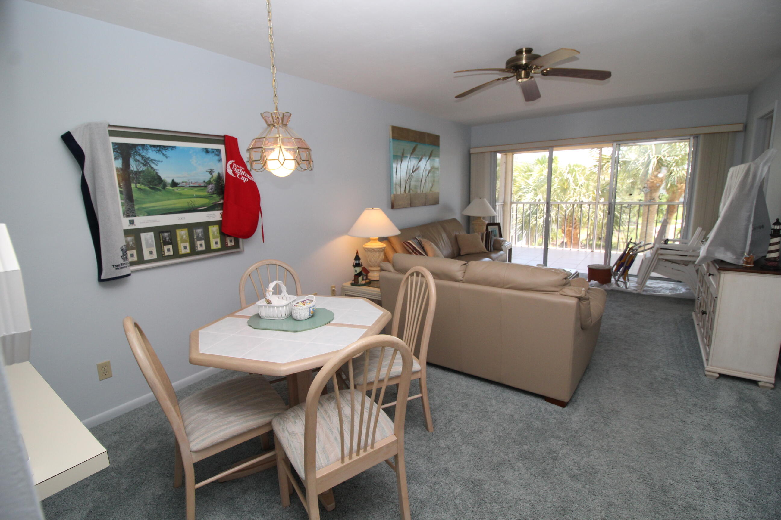 1024 Manatee Naples, Unit C301 Naples, FL 34114 - Photo 4 of 23 a view of a dining room with furniture window and outside view