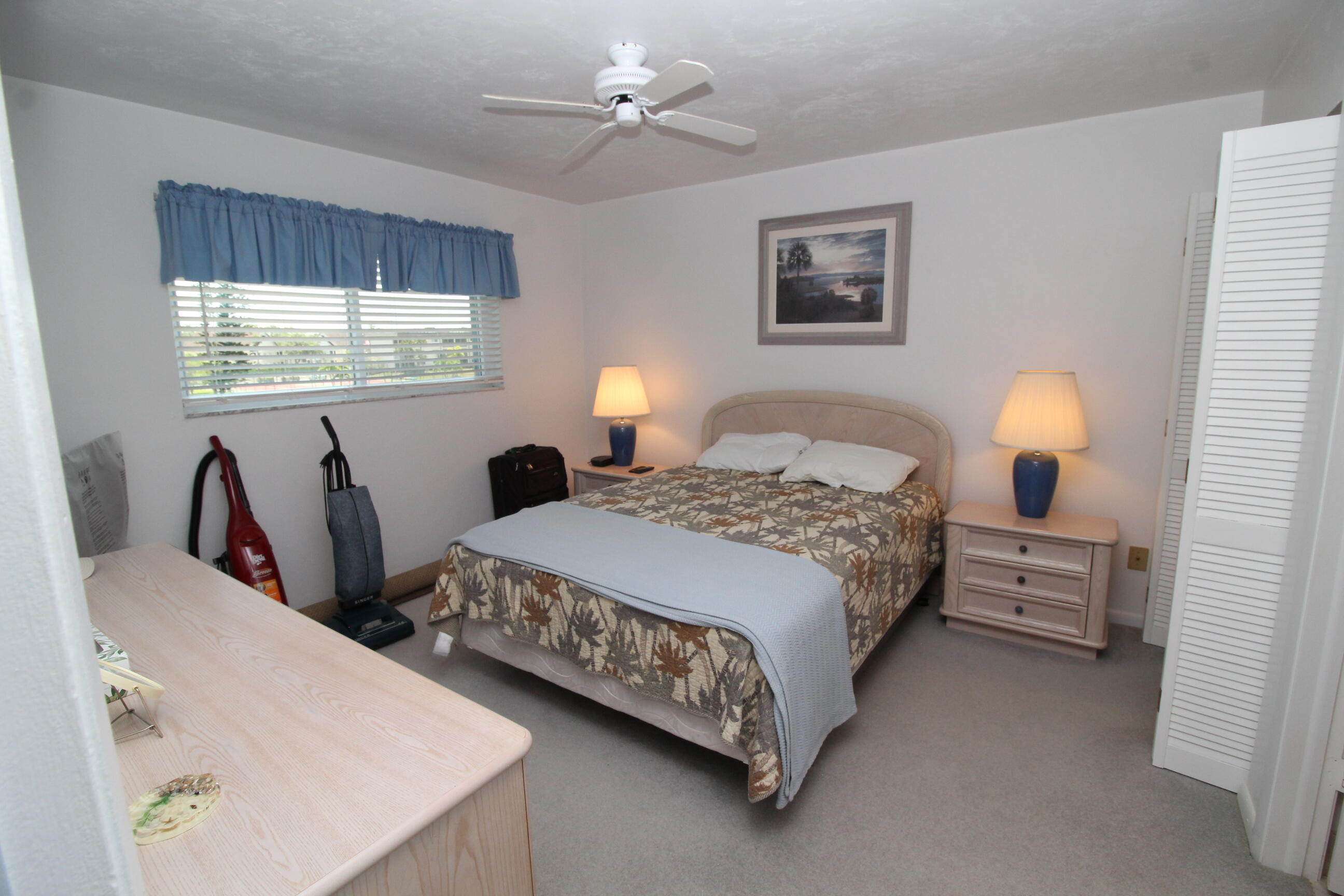 1024 Manatee Naples, Unit C301 Naples, FL 34114 - Photo 8 of 23 a bedroom with bed and window