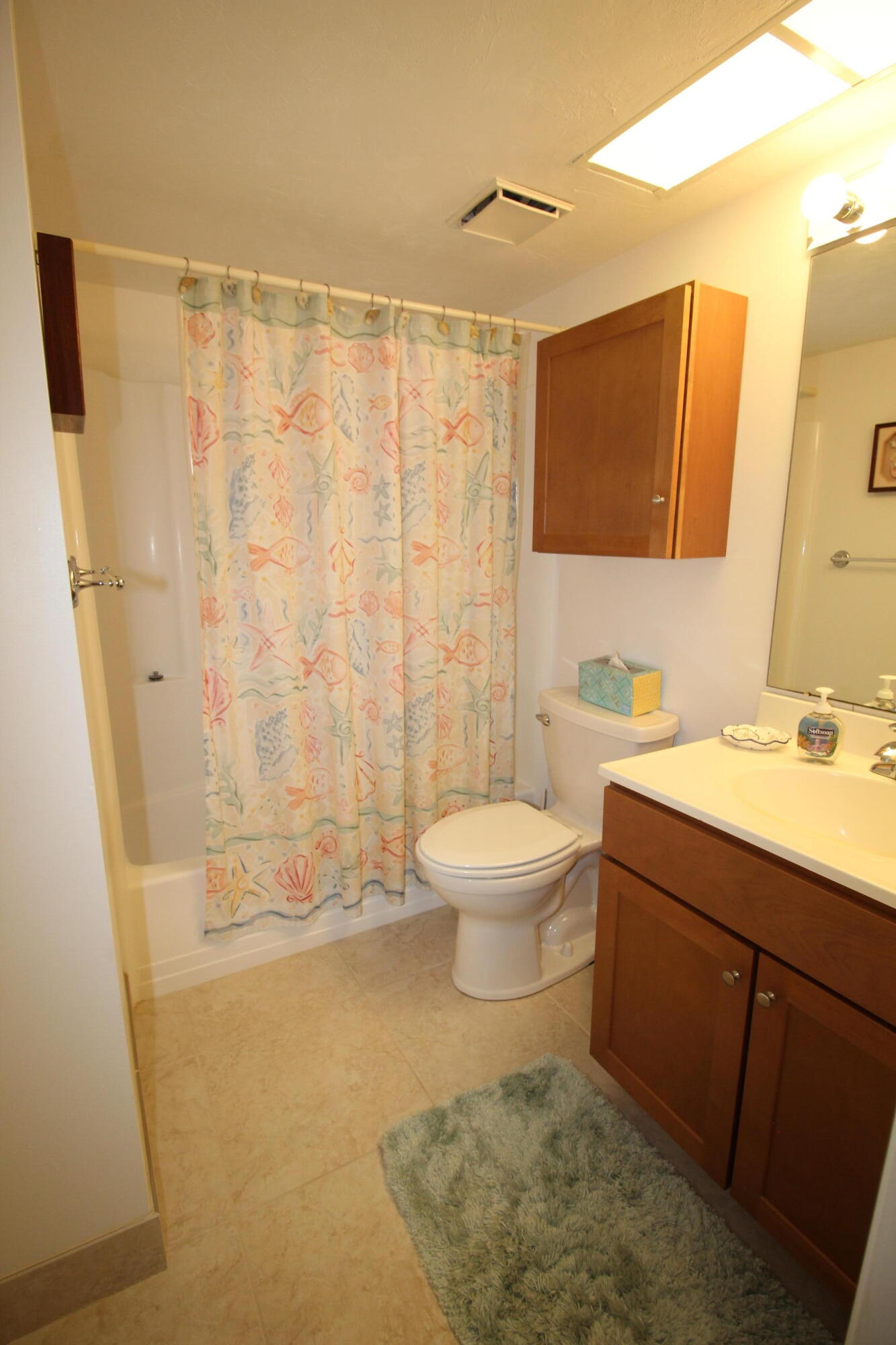 1024 Manatee Naples, Unit C301 Naples, FL 34114 - Photo 9 of 23 a bathroom with a sink a toilet and shower