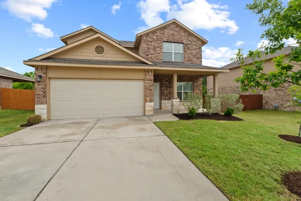 front view of a house with a yard