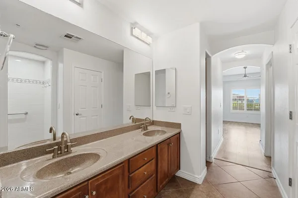 a bathroom with a sink double vanity and a mirror