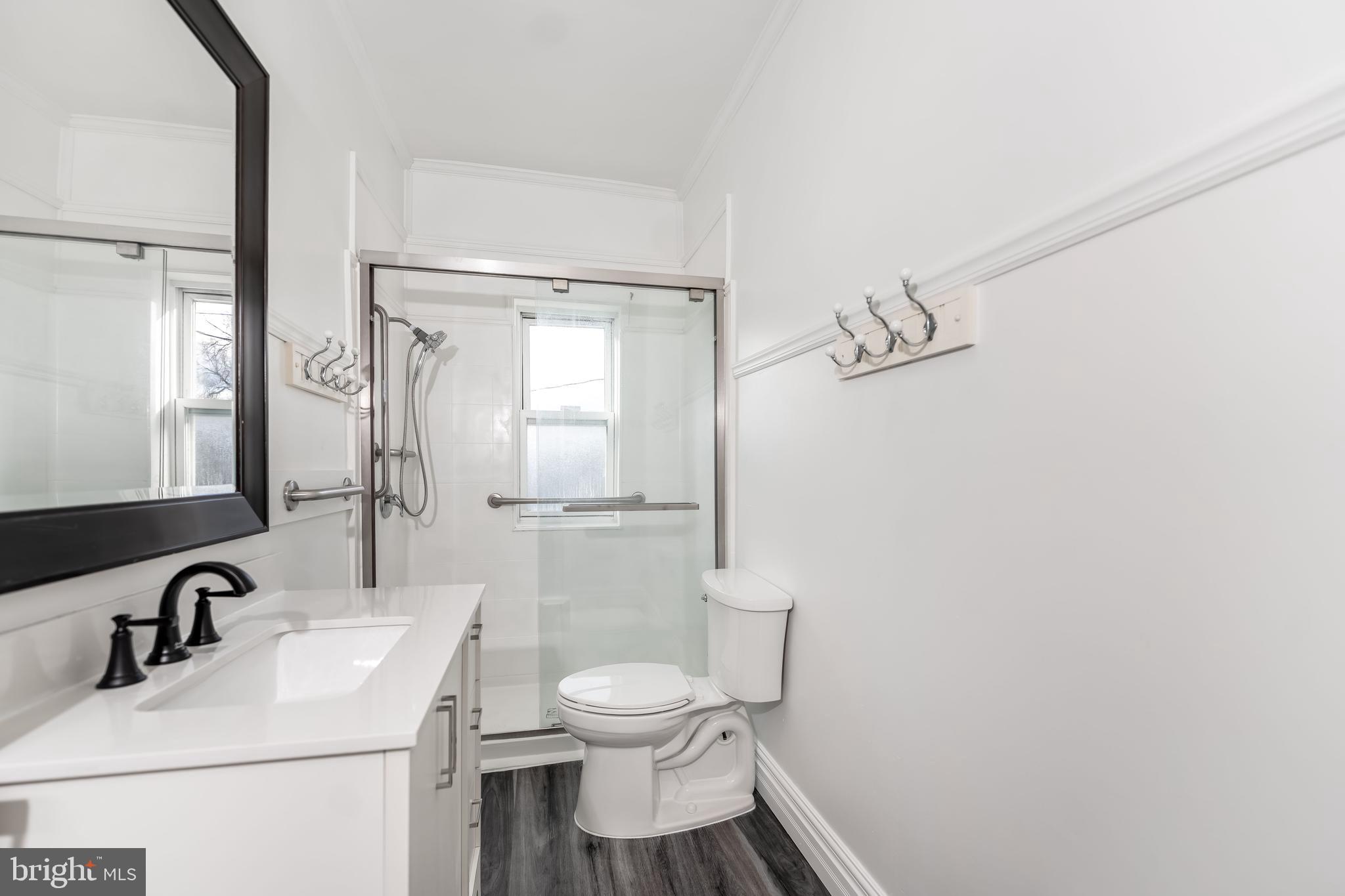 2500 Derry Street Harrisburg, PA 17111 - Photo 13 of 30 a bathroom with a sink toilet and mirror
