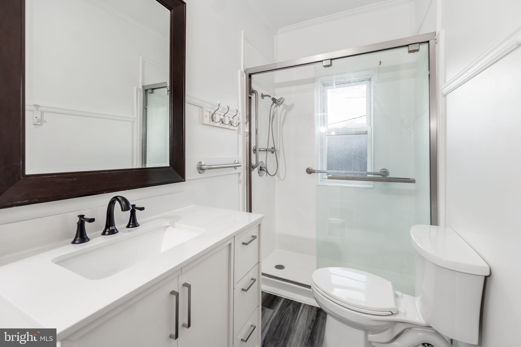 2500 Derry Street Harrisburg, PA 17111 - Photo 14 of 30 a bathroom with a sink toilet vanity and shower