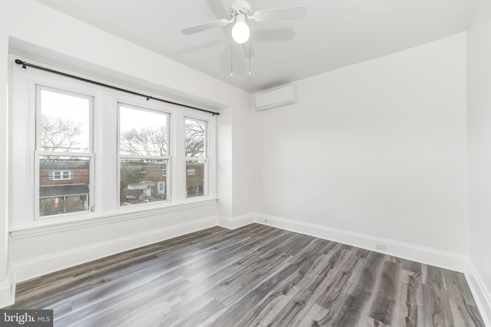 2500 Derry Street Harrisburg, PA 17111 - Photo 17 of 30 a view of an empty room with wooden floor and a window