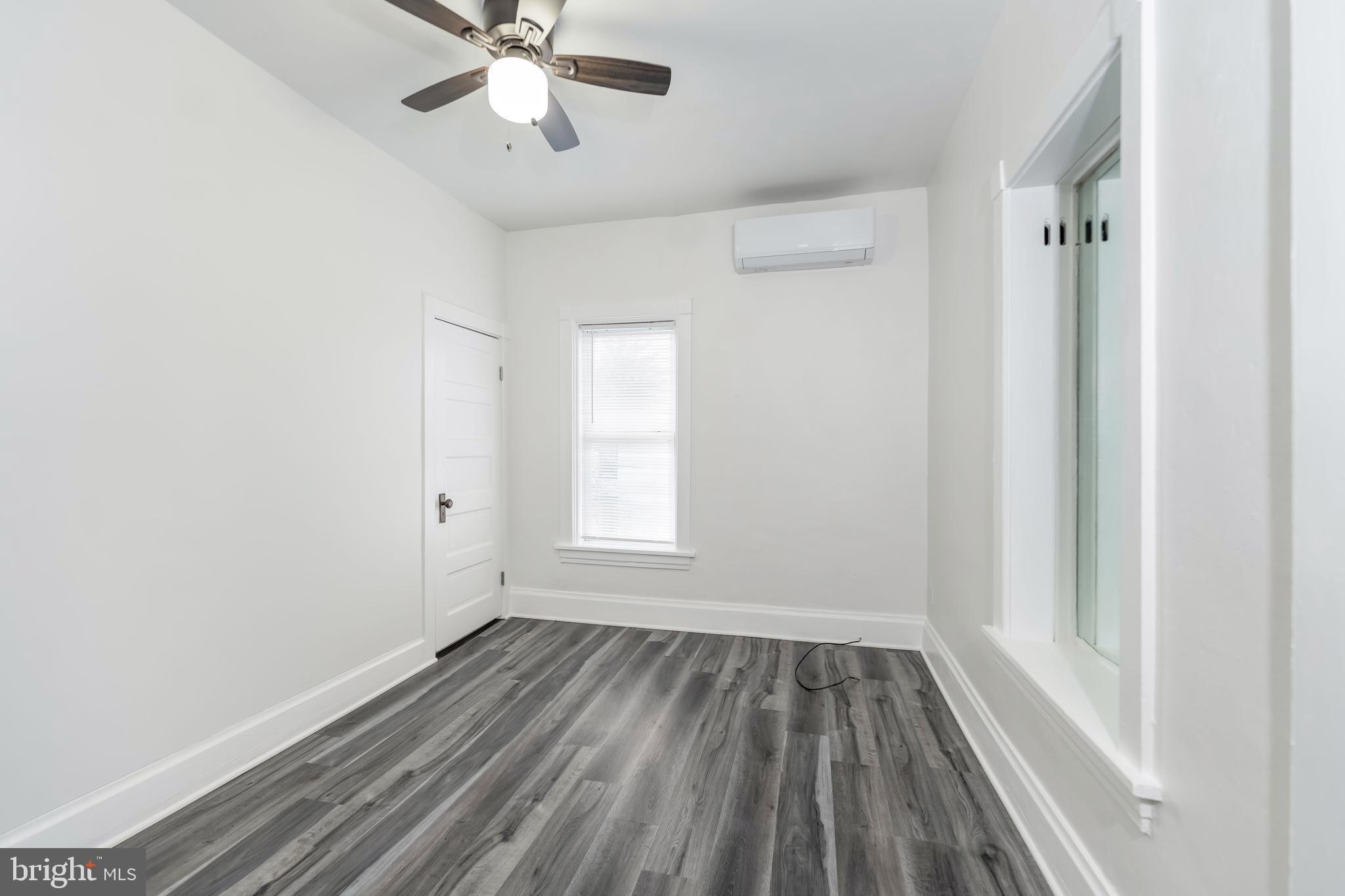 2500 Derry Street Harrisburg, PA 17111 - Photo 20 of 30 a view of an empty room with wooden floor and a window