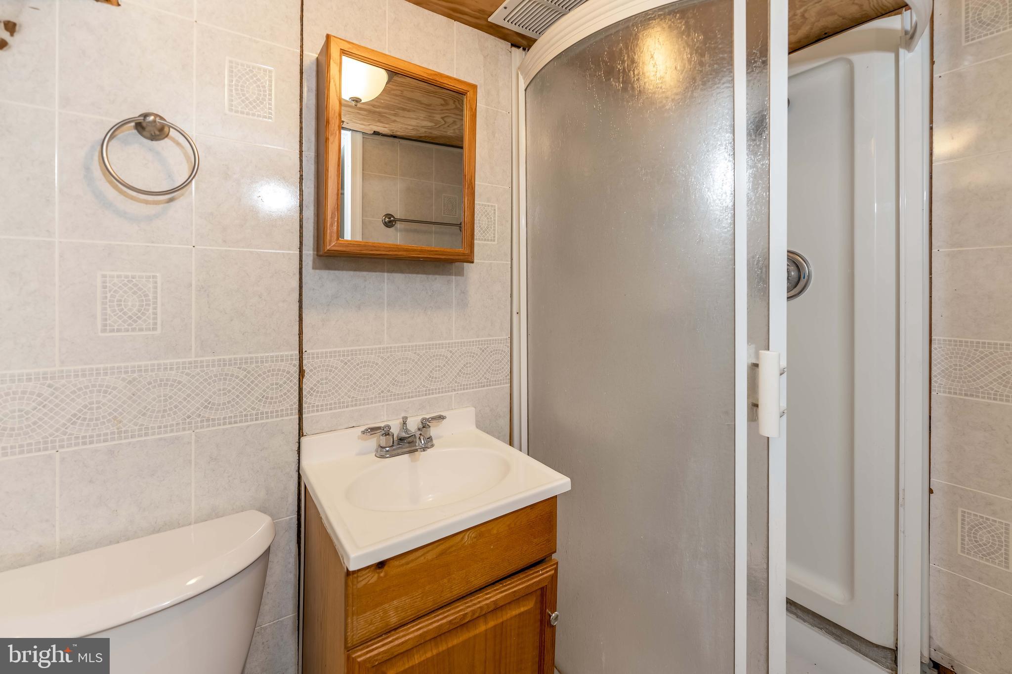 2500 Derry Street Harrisburg, PA 17111 - Photo 25 of 30 a bathroom with a sink and a mirror
