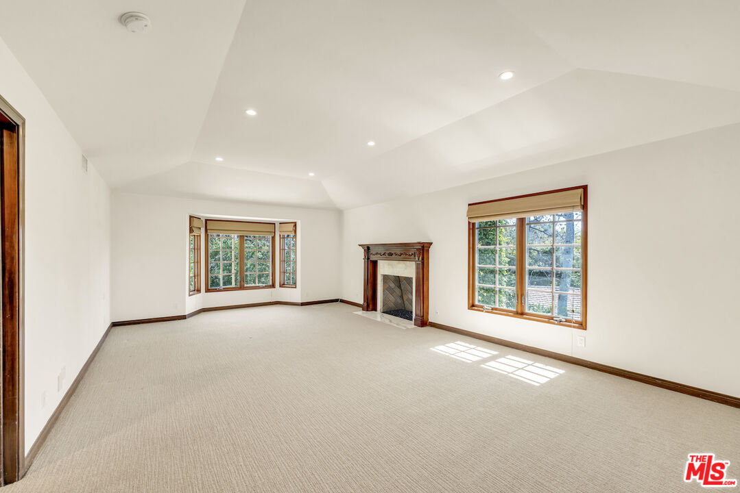3274 Hutton Drive Beverly Hills, CA 90210 - Photo 13 of 23 an empty room with windows