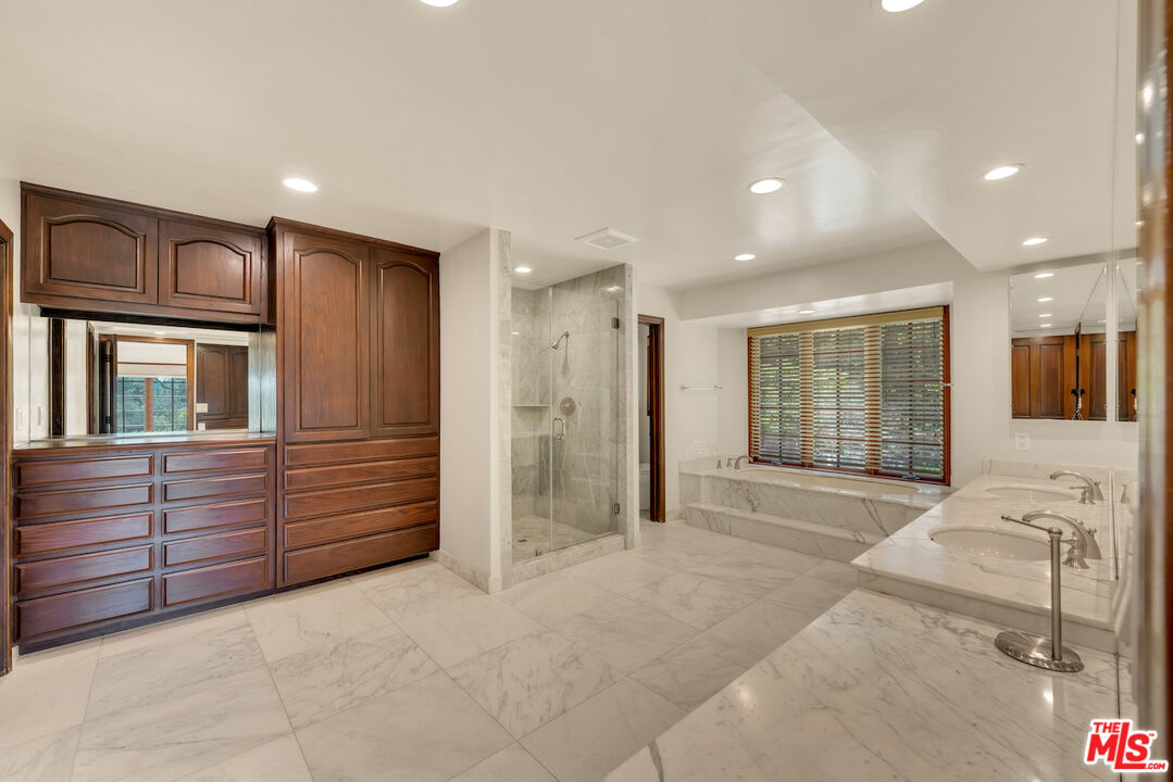 3274 Hutton Drive Beverly Hills, CA 90210 - Photo 14 of 23 a spacious bedroom with a large bed and large windows