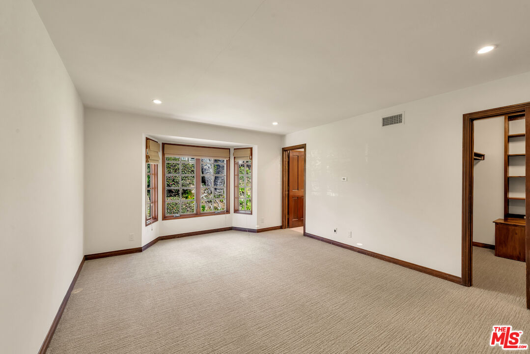 3274 Hutton Drive Beverly Hills, CA 90210 - Photo 16 of 23 a view of an empty room with a window