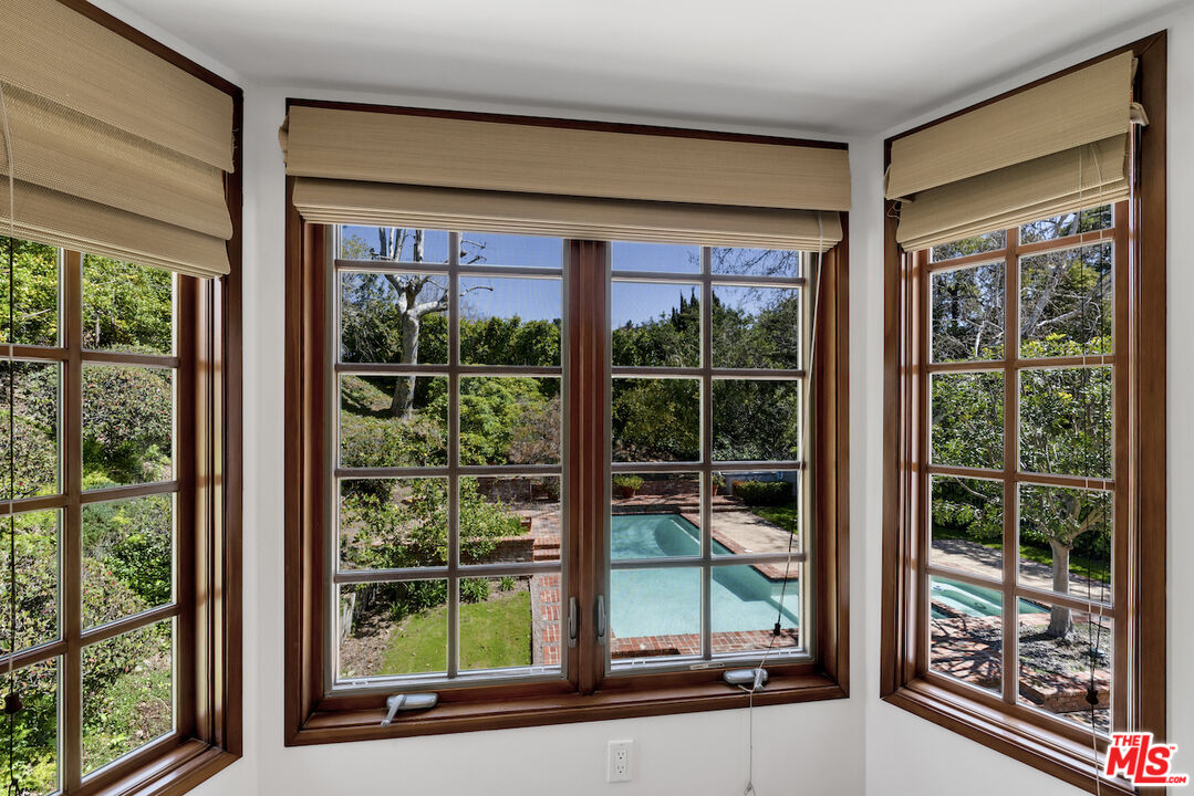3274 Hutton Drive Beverly Hills, CA 90210 - Photo 17 of 23 a view of a room with a large window and wooden floor