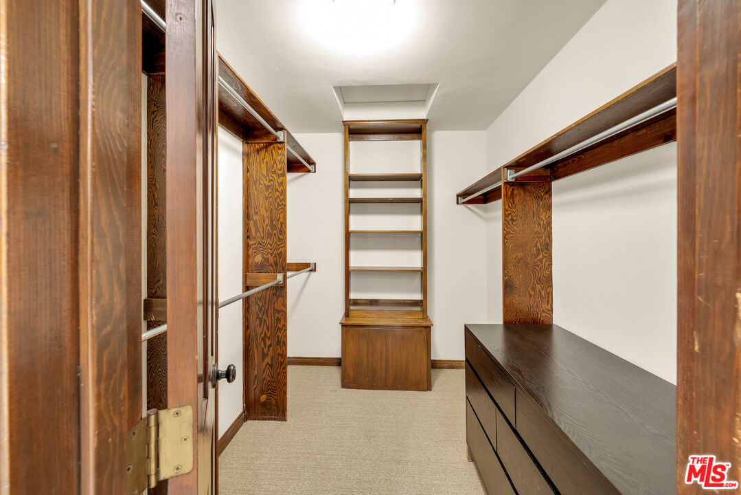 3274 Hutton Drive Beverly Hills, CA 90210 - Photo 18 of 23 a view of walk in closet with empty racks