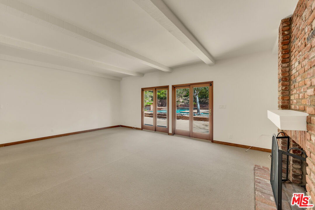 3274 Hutton Drive Beverly Hills, CA 90210 - Photo 6 of 23 an empty room with windows