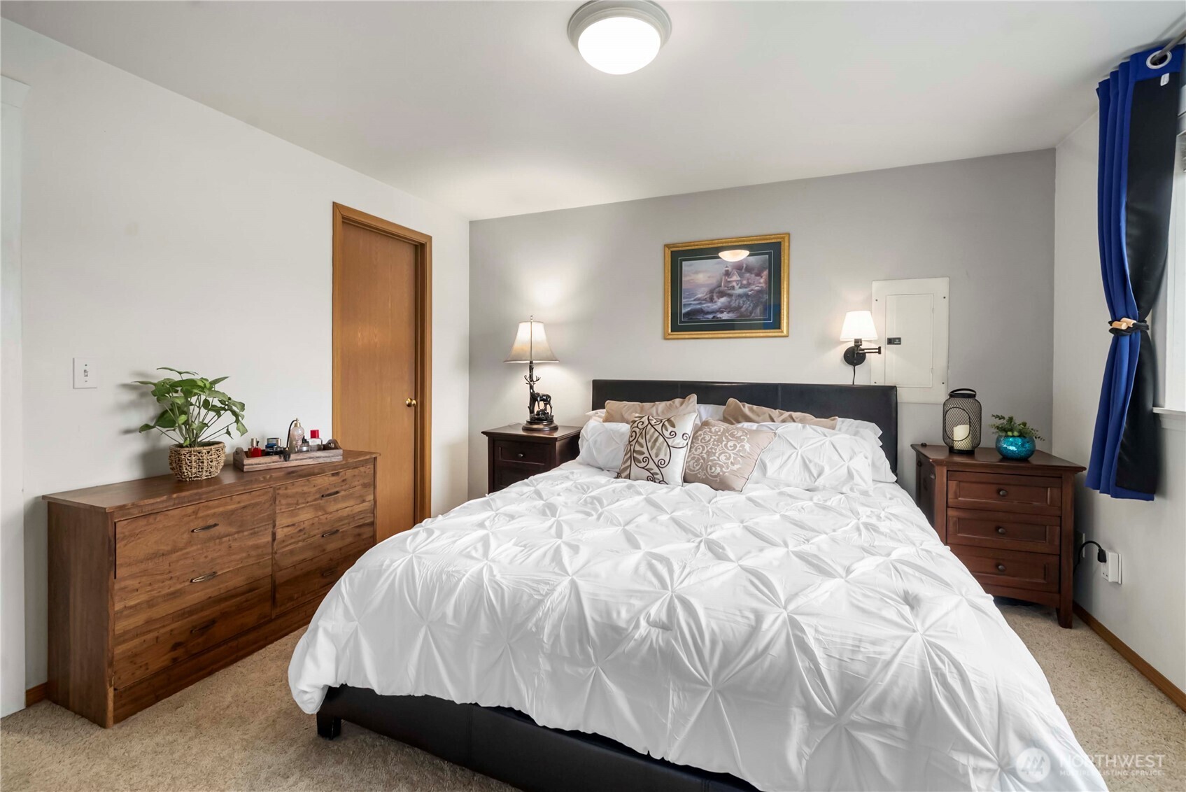 1010 Academy Street Sumner, WA 98390 - Photo 23 of 37 a bedroom with a bed and a potted plant on dresser