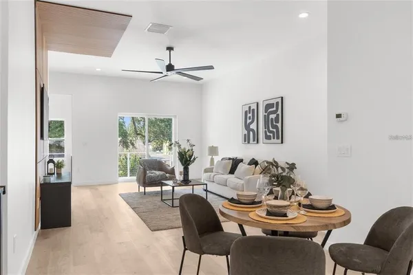 a dining room with furniture and window