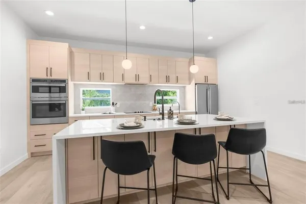 a kitchen with a sink and cabinets