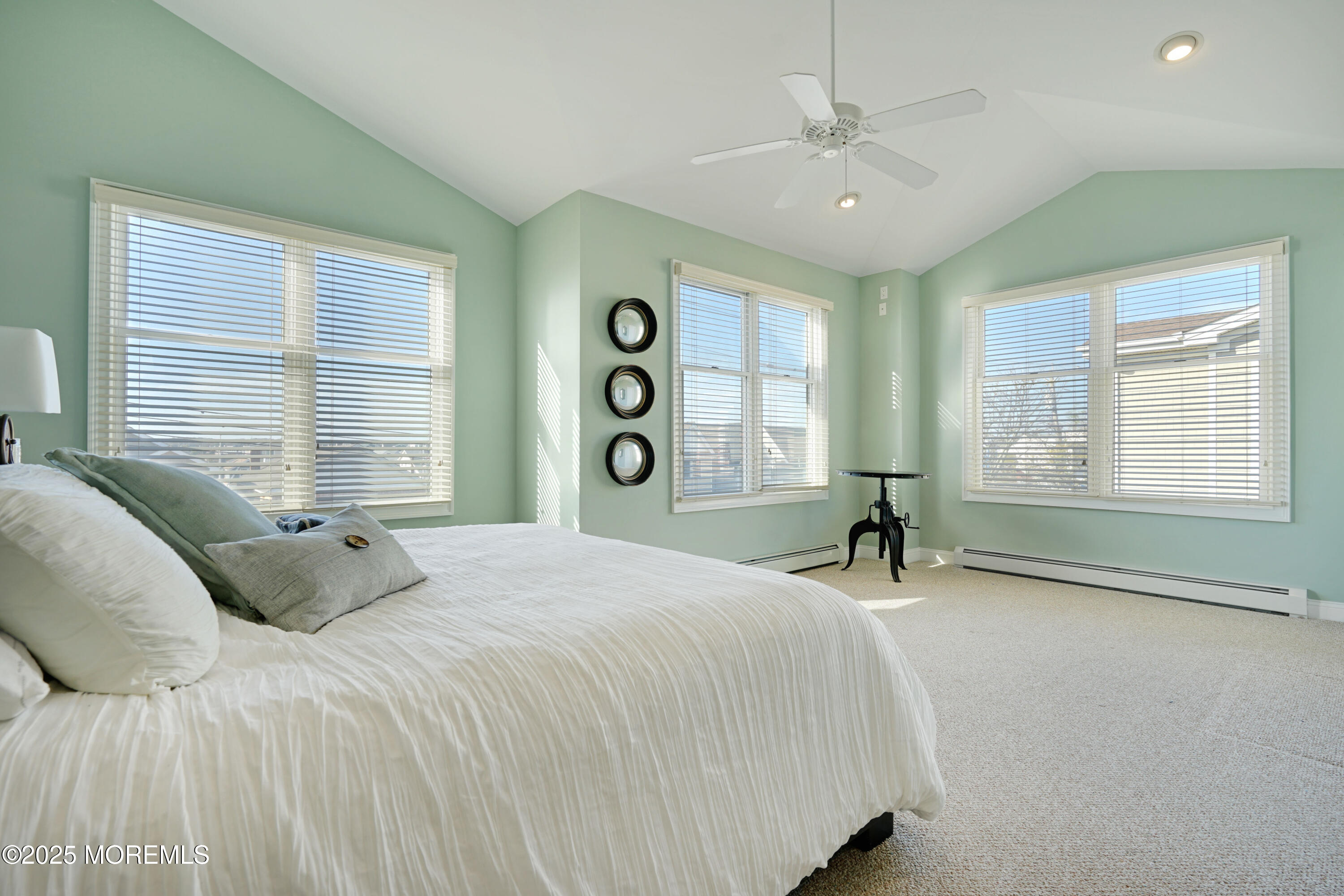 233 Beach Front, Unit 3 Manasquan, NJ 08736 - Photo 12 of 18 a bedroom with a bed and a window