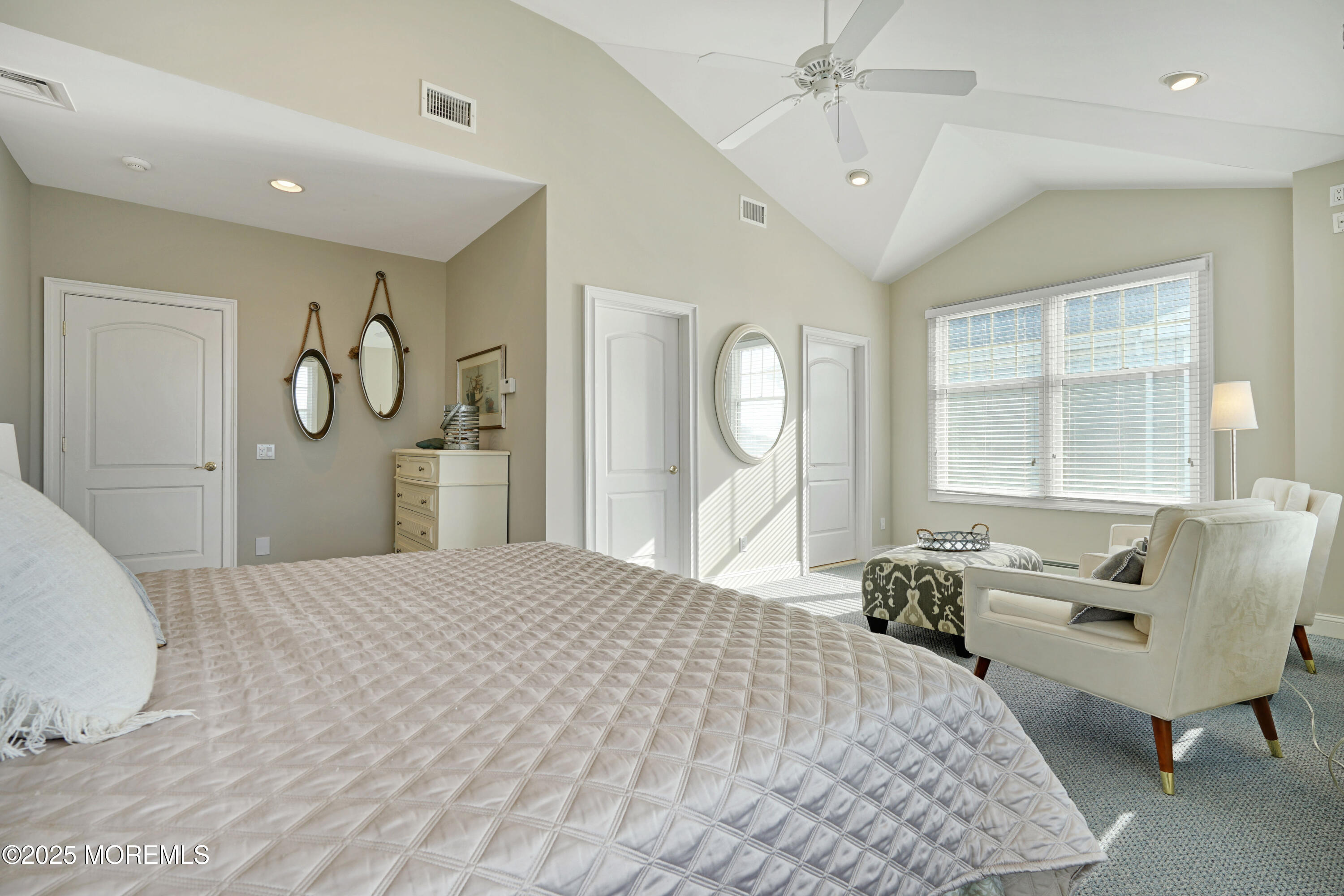 233 Beach Front, Unit 3 Manasquan, NJ 08736 - Photo 6 of 18 a bedroom with a bed mirror and window