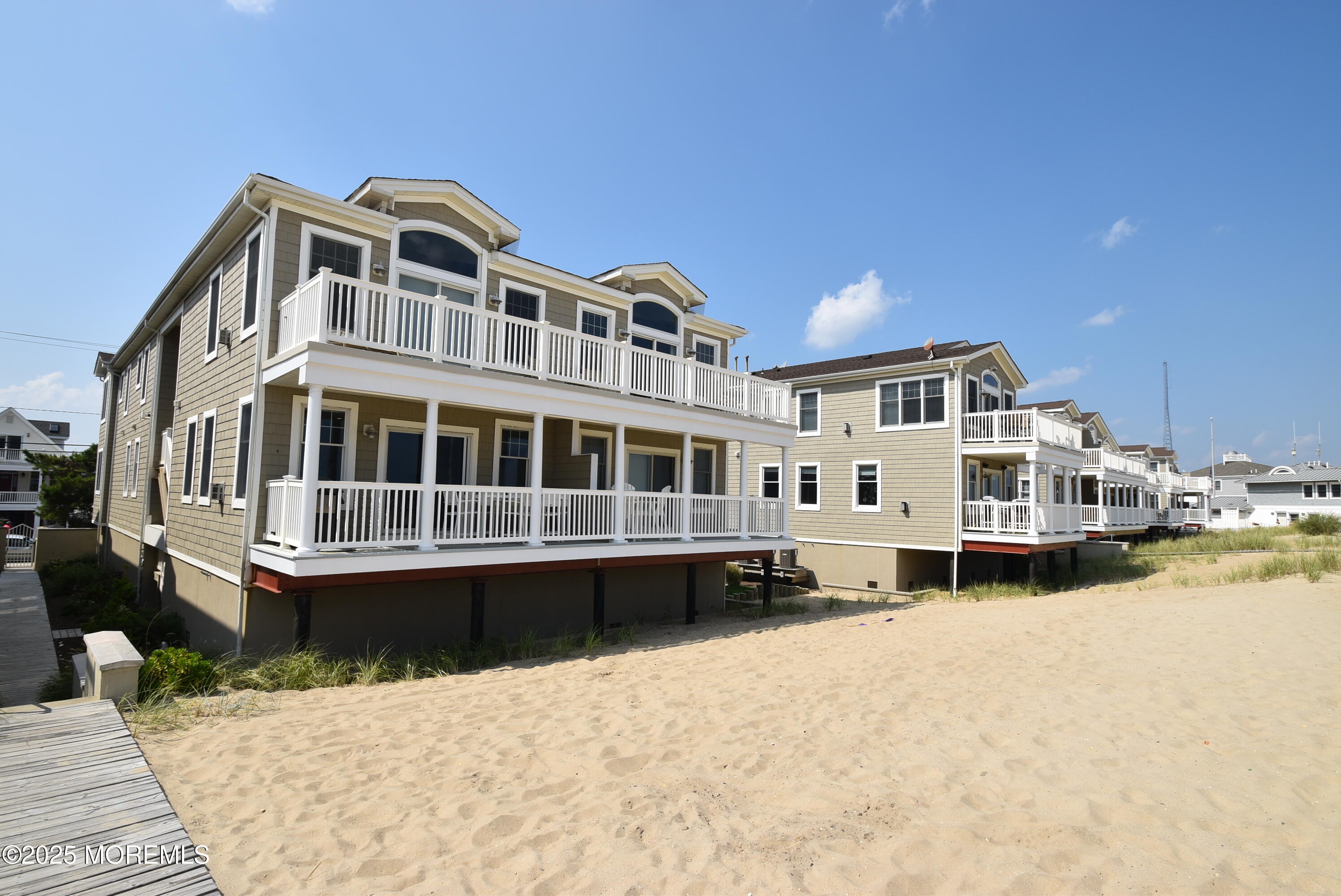 233 Beach Front, Unit 3 Manasquan, NJ 08736 - Photo 9 of 18 a front view of a house with a yard