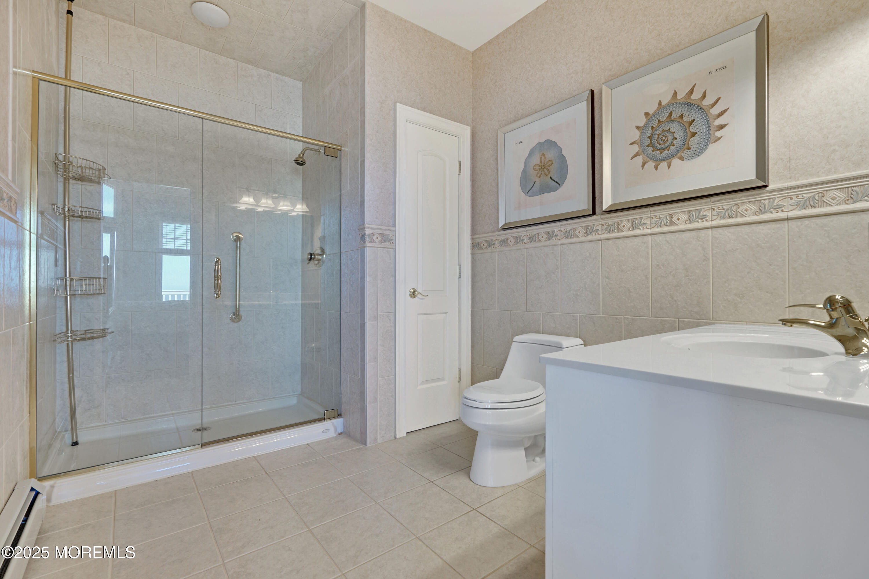233 Beach Front, Unit 3 Manasquan, NJ 08736 - Photo 10 of 18 a bathroom with a toilet sink and shower