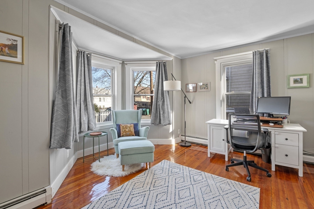 10 Stoddard Terrace Lynn, MA 01902 - Photo 16 of 40 a living room with patio furniture and a wooden floor